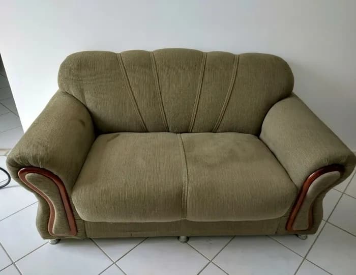 Crushed and marked velvet sofa before cleaning